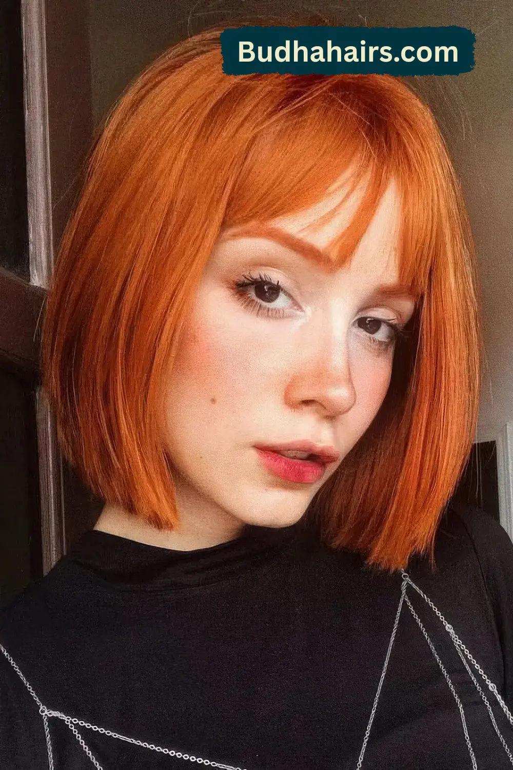 Bold Red and Blonde Layered Bob with Eye-Covering Bangs