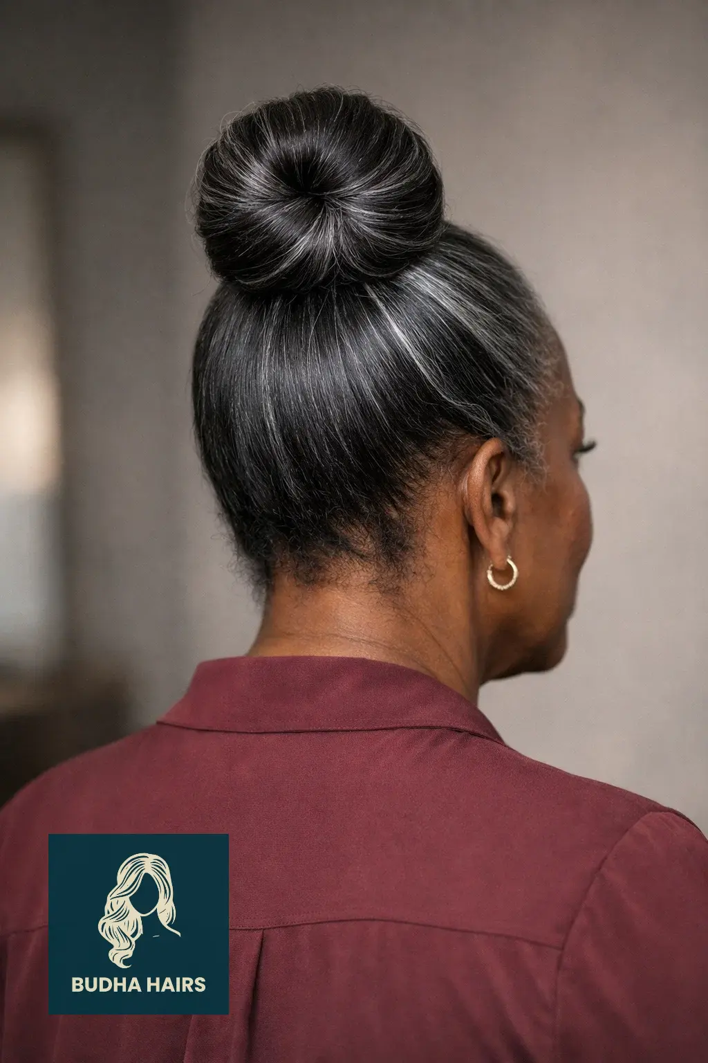 25 Easy and Elegant Updo Hairstyles for Older Black Women 16 Sleek Top Knot with Silver Strand